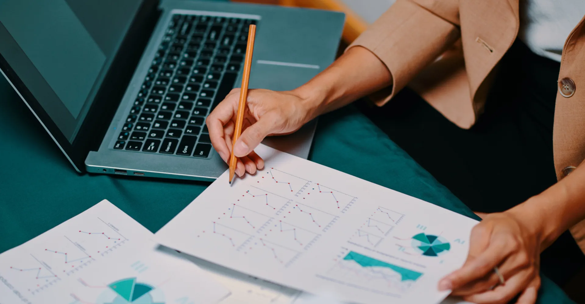 A woman holding papers with evaluations